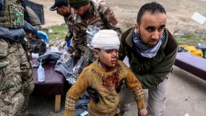 Thousands flee Iraq’s Mosul overnight, as fighting rages on