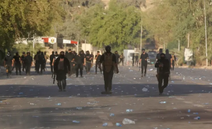 Two killed as Iraq’s powerful Sadr quits politics, clashes erupt and curfew imposed