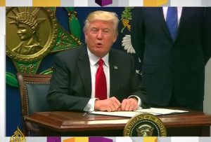 Justice department appeals blocking of US travel ban